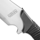 Zoomed view of high carbon steel with Forged Warrior engraved leading into the PU wrapped handle
