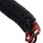 It has a keenly pointed, 17” blade with aggressive cut-outs on the spine leading up to the traditional black cord-wrapped handle