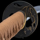 It has an antiqued brass, round tsuba with an intricately detailed water buffalo god design