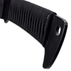 The handle is wrapped Samurai style in faux black rayskin and black nylon cord and it has a lanyard hole in the pommel