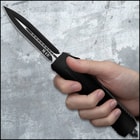 A view of the knife's spear point blade