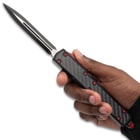 Red and Black Nightpiercer in hand