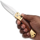 Vanguard Auto Knife Gold in hand