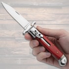 The Pakkawood Automatic Stiletto displayed in hand
