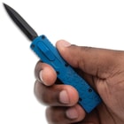 Blue ShadowMaster Mini OTF Knife in hand