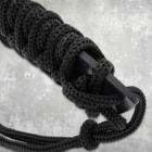 Close-up of black cord-wrapped handle on machete