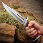 Gil Hibben 3 Knife Rambo Knife held firm grip.Long blade and sleek polished finish,  featuring a prominent fuller groove. A partially serrated spine.Double-edged guard.
