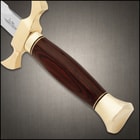 Close-up of dagger's wooden handle and gold pommel
