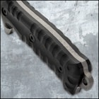 Upclose view of a M48 titanium electroplated blade with a partial sawback spine with jagged edges and a "M48" logo on the blade. 
