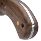 The knife has a 5 7/8”, razor-sharp 1095 high carbon steel blade with an aggressive sawback and thumb jimping