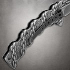 Close-up of knife handle with chain design