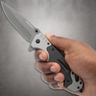 Hand holding a Rampage folding knife