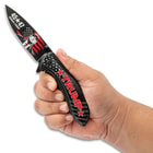 Trump Knife Held in hand