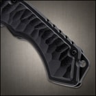 7 3/4" blacked out pocket knife with scalled inserts and a ball bearing blade mechanism.
