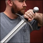 A person holding the sword.