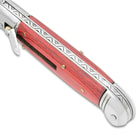 A detailed look at the automatic knife's handle with its fileworked spine