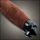 The knife has a 5 1/2”, HellFyre Damascus steel blade that’s split into two penetrating points with razor-sharp edges