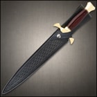 Dagger sheathed in a black leather belt sheath