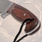Close-up of knife's polished wooden handle