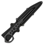 Slim black knife with pentrating point protected inside black nylon sheath while the handle and open-ring pommel remains exposed.
