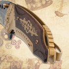 Close-up of steampunk knife handle with gear engravings