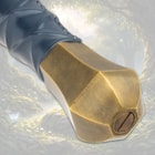 Close-up of a sword's brass pommel and leather-wrapped handle