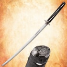 Full view of katana with detailed pommel and blade inscription