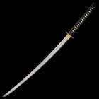 It has a 28”, razor-sharp 1045 carbon steel blade with a visible hamon, which extends from a brass habaki