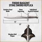 Lord of the Rings Frodo holds gold ring with intense stare with sting sword shows runes engraved on blade and handguard
