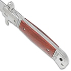 A side view of the Pakkawood Automatic Knife's handle