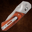 Folded Timber Wolf knife with wood handle and clip