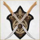 Two crossed knives on a decorative wall mount