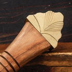 A close-up of the Viking sword's brass pommel