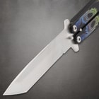 Close-up of butterfly knife blade and handle with dragon design
