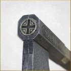 Close view of stainless steel blade head with Gimli emblem on poll of axe
