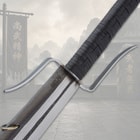 Close-up of sword guard and handle with mountain background