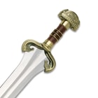 A zoomed view of the hilt cast with the horses of Rohan and brown leather wrapped grip. 