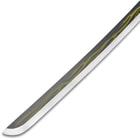 Zoomed view of the point of the carbon steel blade with yellow lightning bolt design.
