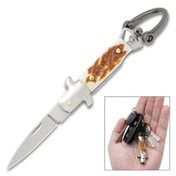 Keychain opened and inset of it on keys in hand.