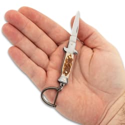 The open keychain laying on hand.