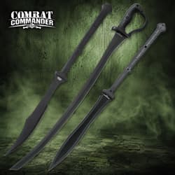 Three black swords with textured handles on green background