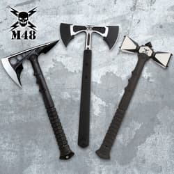 Three tactical axes with black handles on a textured background
