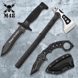 Axe, knife, and karambit on textured surface