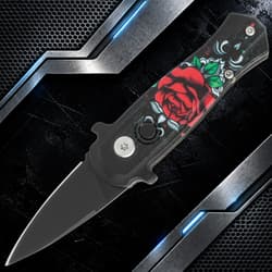 Black knife with red rose design on handle