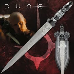 Decorative knife with intricate designs and a character in the background