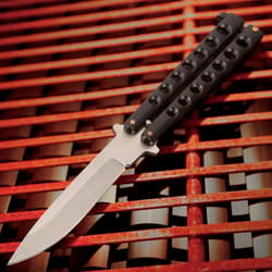 The Black Beast Butterfly Knife has a stainless steel blade and black matte finished skeletonized handle.