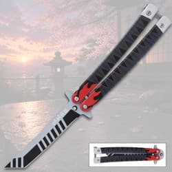 Butterfly knife with flame design on a scenic background