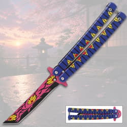 Colorful butterfly knife with floral design, sunset background