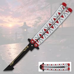 Butterfly knife with red and white handle, scenic background