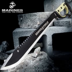 Black machete with 'Semper Fidelis' on concrete blocks